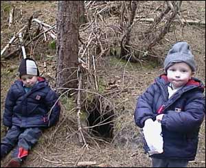 Mike Roberts' sons Ethan and Cole by a foxes den in Newborough Forest