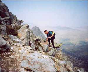 Rod Holt sent this picture of a scrambler on the screes of Bristly, with Tryfan in the background