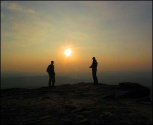 Andreas Daniel and Edward Elwyn Jones on Pen y Fan after completing the Three Peaks Challenge