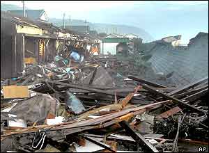 Debris are seen in Muroto, south-western Kochi prefecture Wednesday, Oct. 20, 2004 after massive waves destroyed breakwater and slammed into the coastal area. 