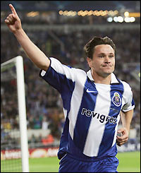 Substitute Dmitri Alenitchev celebrates his 74th-minute goal that completes a 3-0 for Porto