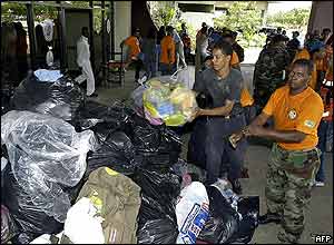 Dominican National Civil Defense and Emergency Commission staff preparing to send aid to Jimani