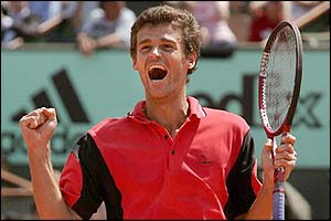 Kuerten celebrates after beating Federer
