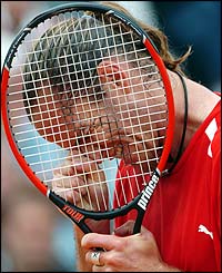 Xavier Malisse of Belgium reacts with delight after beating Albert Costa of Spain 