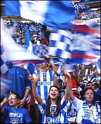 Brighton fans wave flags at the Millennium Stadium