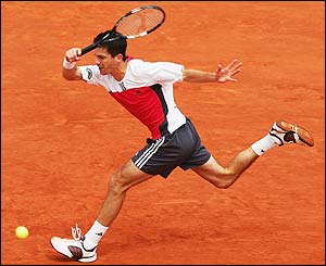 Henman plays a passing shot down the line