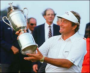 Raymond Floyd holds the US Open trophy aloft after winning the title in 1986