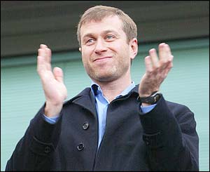 Roman Abramovich waves to the crowd at Stamford Bridge