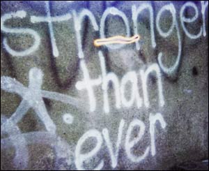 A domestic violence survivor uses street graffiti for her message