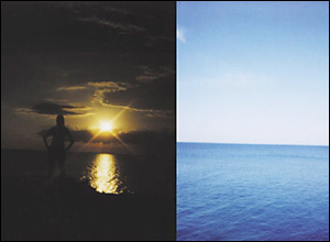 A dark sky and light on water