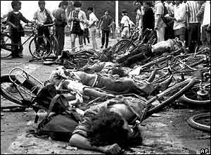 The bodies of dead civilians lie among mangled bicycles near Beijing's Tiananmen Square early June 4, 1989