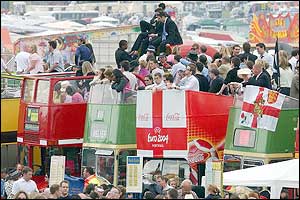 Buses line the side of the race track at Epsom