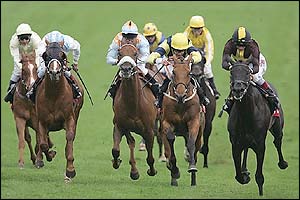 Passing Glance ridden by Martin Dwyer (right) wins The Vodafone Diomed Stakes