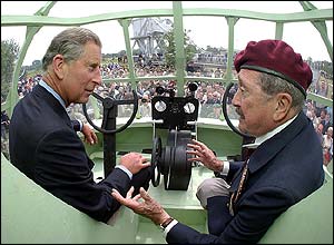 Prince Charles sits with veteran pilot Jim Wallwork inside a replica of one of the giant gliders used in the daring raid on Pegasus Bridge 60 years ago.