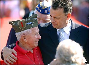 US actor Tom Hanks chats with a WWII veteran at the US cemetery in Colleville-sur-me