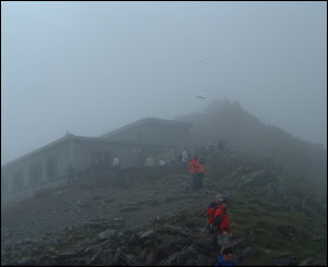 Snowdon cafe in the mist and the crowds on the summit (Philip Coleman)