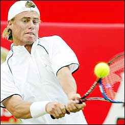 Australia's Lleyton Hewitt strikes a return at Queen's Club