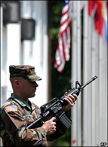 US soldier in Bosnia fires a salute to honour Reagan on the day of his funeral