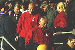 Woodward walks dejectedly from the stands