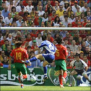 Portugal fail to close down the advancing midfielder and pay the price as he gets the first goal of Euro 2004