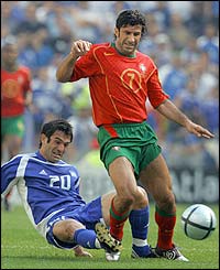 Greece's Karagounis fouls Portugal's Luis Figo
