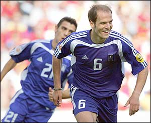 Greece's Angelo Basinas celebrates scoring a penalty