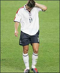 England's first-half hero Frank Lampard trudges dejectedly from the pitch as England lose