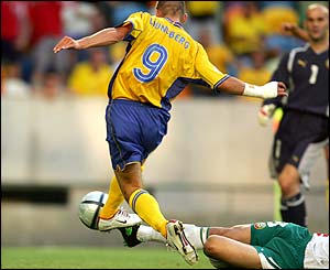 Freddie Ljungberg strikes home the opening goal of the game