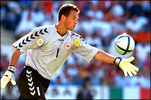 Denmark keeper Thomas Sorensen clears the ball