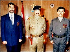 Uday and Qusay Hussein with their father