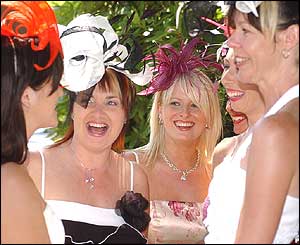 A group of ladies at Royal Ascot show off their hats