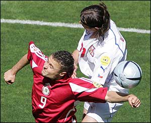 Latvian midfielder Maris Verpakovskis and Czech Republic defender Tomas Ujfalusi 