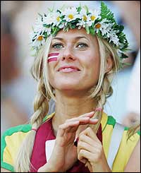 A Latvian fan enjoys her team's unexpected half-time lead