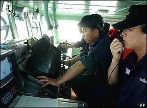 South Korean Navy sailors communicate with their North Korean counterparts on the western maritime border near Yeonpyeong Island, South Korea, Monday, June 14, 2004