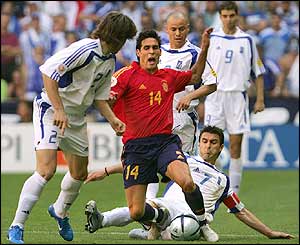 Spain's midfielder Vicente is tackled 