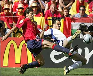 Spanish striker Fernando Morientes battles with Traianos Dellas