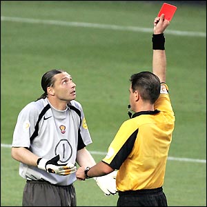 Norwegian referee Terje Hauge wastes no time brandishing the inevitable red card and Russia are left with ten men