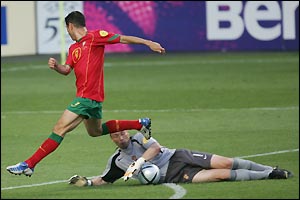 There is drama on the stroke of half-time as Russia's goalkeeper Ovchinnikov handles the ball outside of his area