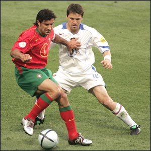 Luis Figo looks for a way through the stubborn Russian defence