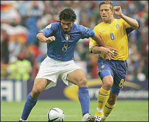 Italy's Gennaro Gattuso holds off Anders Svensson 