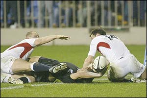 New Zealand's Daniel Carter scores a try