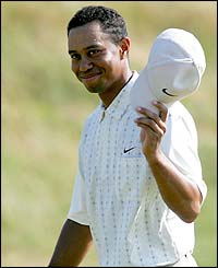 Tiger Woods celebrates an eagle at the 18th