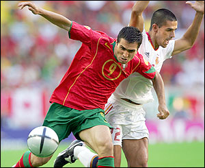 Pedro Miguel Pauleta holds off Juanito Gutierrez 