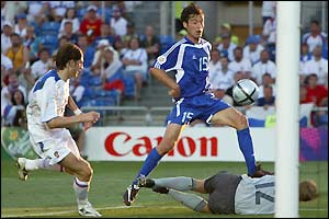 Greece's Zissis Vryzas scores