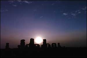 Sun rising over Stonehenge - long shot