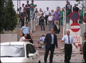 Police help an injured colleague at the scene of a bombing in Ankara