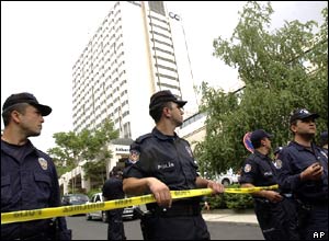 Turkish police cordon off the street leading to the Hilton Hotel in Ankara