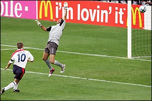 Micahel Owen scores past Portugal keeper Ricardo