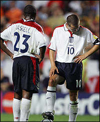 Vassell and Owen stand dejectedly during the shoot-out