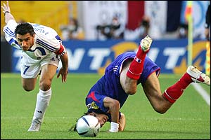 Robert Pires is fouled by Theo Zagorakis